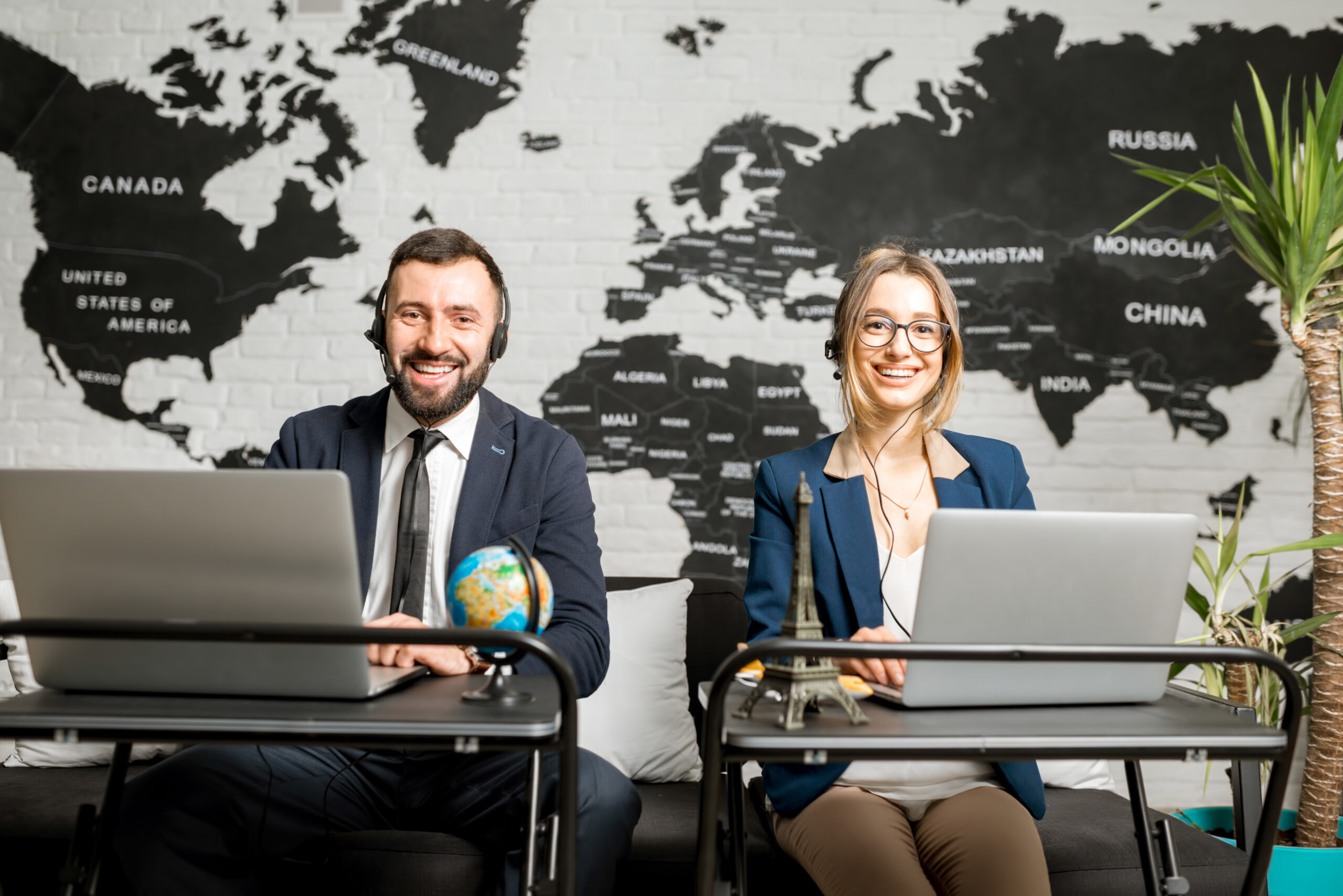 Couple of travel managers working at the office
